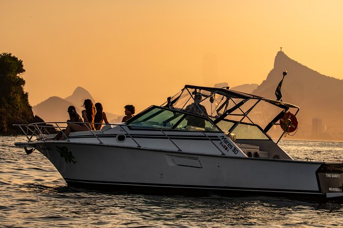 Sunset Boat Tour with Beer, Water, Soda and Snacks included - First impression: a small boat, big Rio light